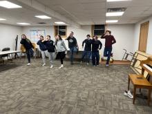 Youth jumping on one foot