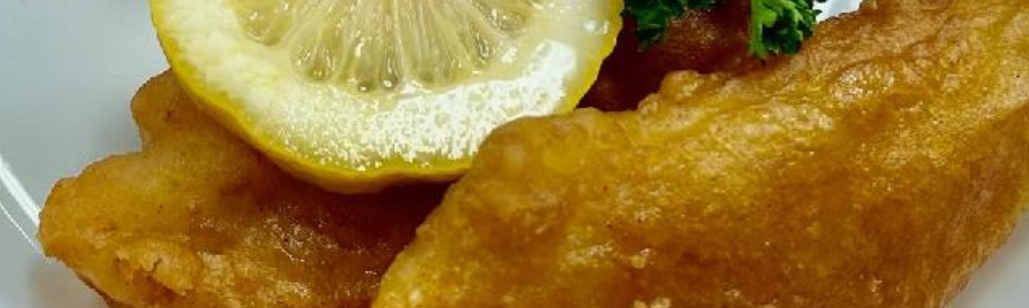 Fish and lemon on plate